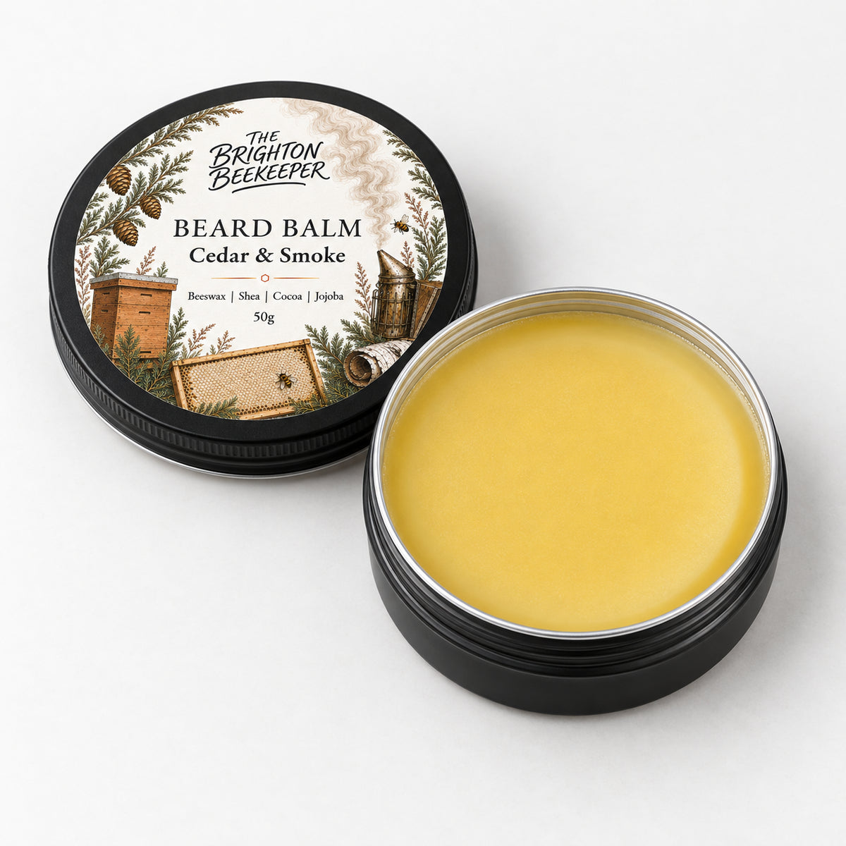 An open tin of Cedar & Smoke Beard Balm, showing the golden balm and illustrated lid