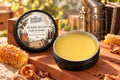 Open Cedar & Smoke Beard Balm with cedar wood, honeycomb and a beekeeper’s smoker